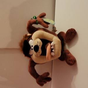 Taz Talks when you squeeze his left hand. He is vintage he was made in 1998